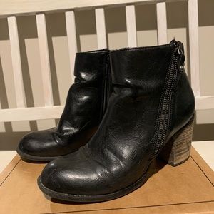 Leather booties with decorative zippers